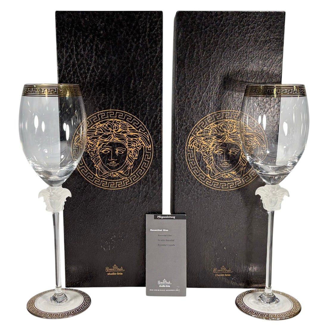 Rosenthal Versace Medusa D'Or Wine Glasses 2pc LOT: Rosenthal for Versace pair of Medusa d'Or white wine glasses. Modern silhouette with bold gilt Greek key trim. Frosted Medusa head stems. Etched base reads Rosenthal studio-linie Germany Versace.