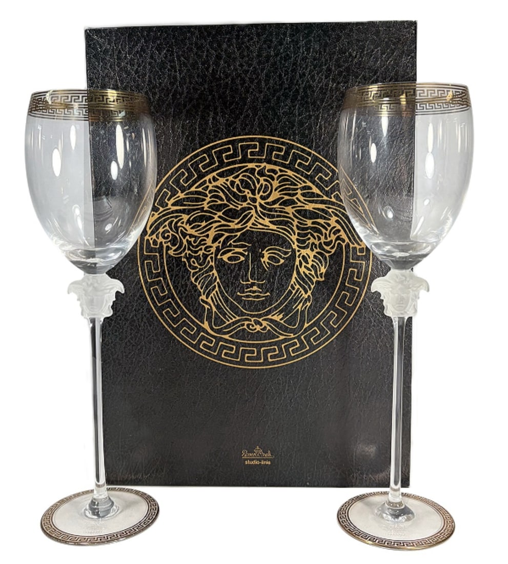 Rosenthal Versace Medusa D'Or Water Glasses 2pcs: Pair of Rosenthal for Versace Medusa d'Or water glasses, crafted in Germany. Frosted Medusa head stems with Greek key trim at rim and base. Etched underside reads Rosenthal studio-linie Germany