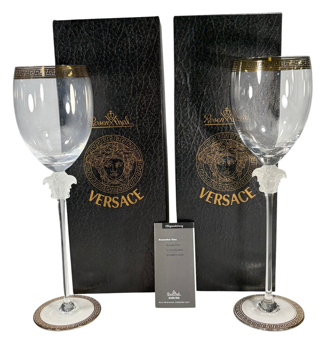 Rosenthal Versace Medusa D'Or Water Glasses 2pcs: Pair of Rosenthal for Versace Medusa d'Or lead crystal water goblets, featuring frosted Medusa head stems and Greek key trim at the rim and base. Etched base reads Rosenthal studio-linie Germany