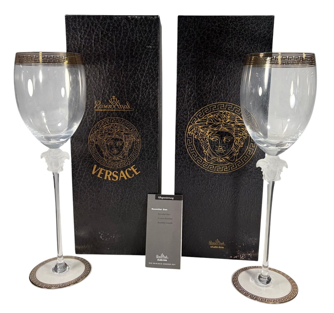 Rosenthal Versace Medusa D'Or Water Glasses 2pcs: Pair of Rosenthal for Versace Medusa d'Or water goblets with frosted Medusa head stems and gilt Greek key banding at rim and foot. Etched base reads Rosenthal studio-linie Germany Versace. Each piece