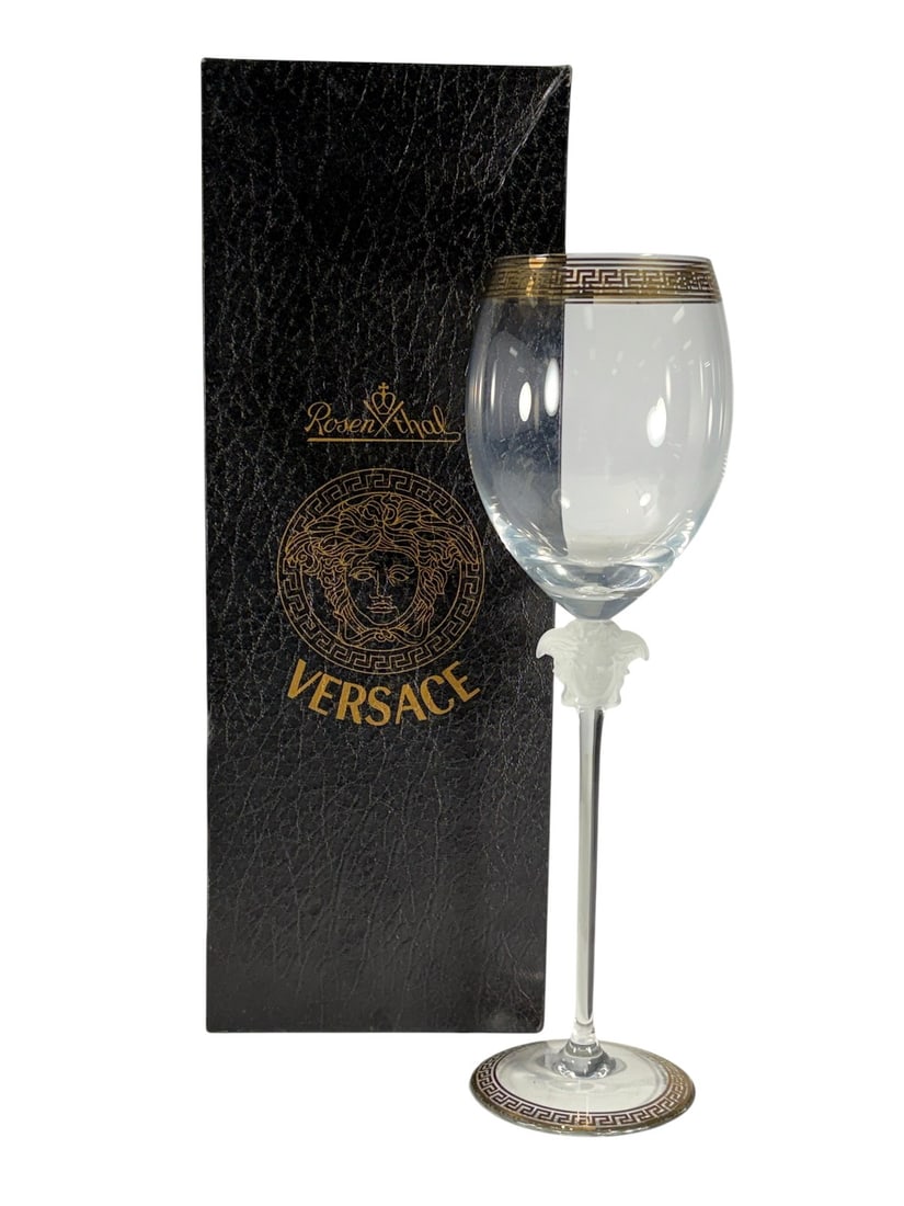 Rosenthal Versace Medusa D'Or Water Goblet: Rosenthal for Versace Medusa d'Or water goblet. Lead crystal with frosted Medusa head stem and gilt Greek key trim. Etched base reads Rosenthal studio-linie Germany Versace. The piece measures 11.5 x