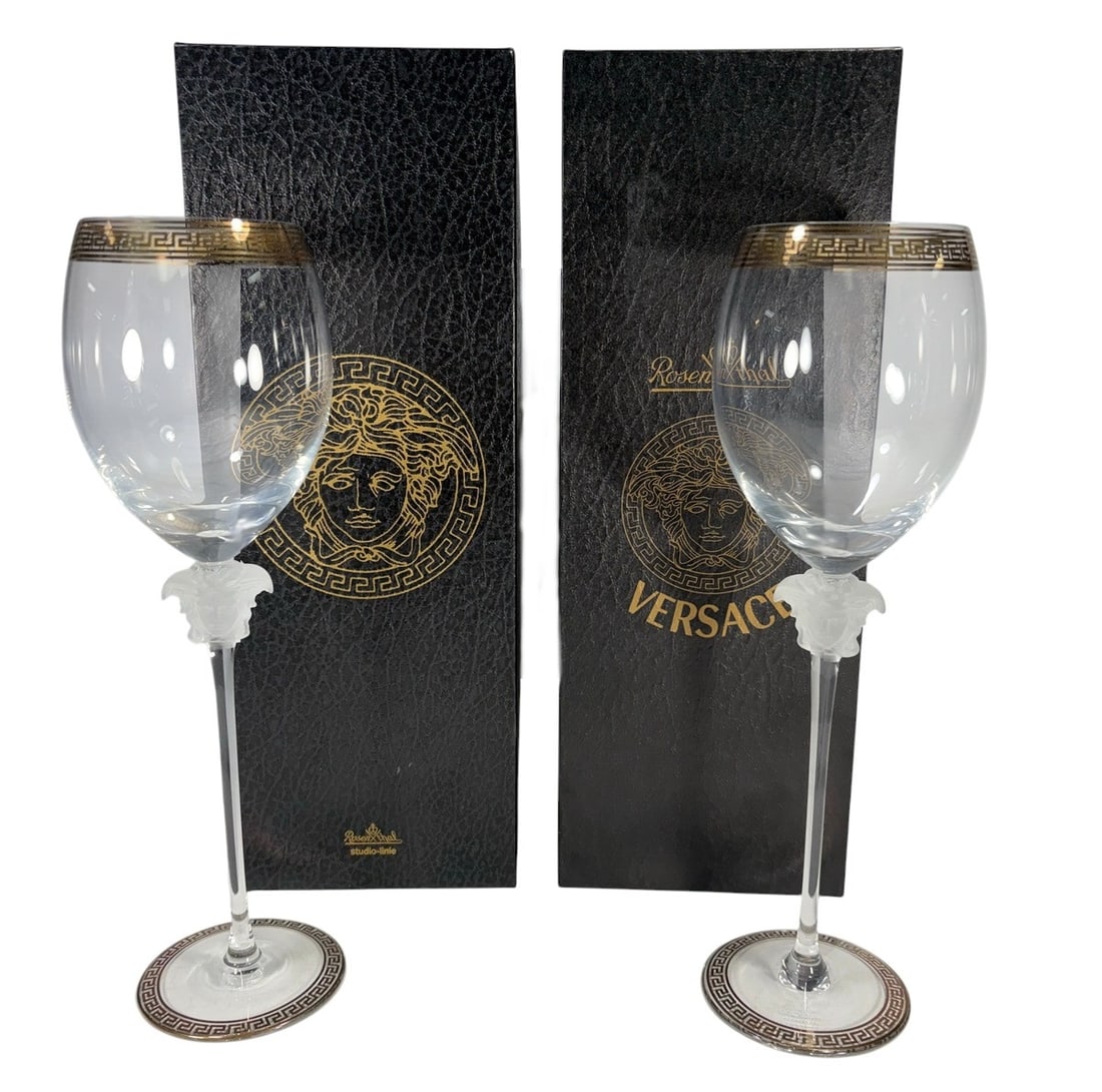 Rosenthal Versace Medusa D'Or Red Wine Glass 2pcs: Rosenthal for Versace pair of Medusa d'Or red wine glasses. Made in Germany, Studio Linie. Frosted Medusa head at base of bowl, clear stem, gilt Greek key trim at foot. Rim with gold and black Greek k