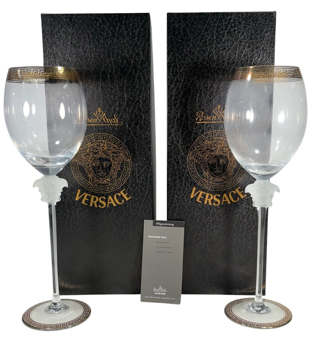 Rosenthal Versace Medusa D'Or Red Wine Glass 2pcs: Rosenthal for Versace pair of Medusa d?Or red wine glasses, made in Germany. Frosted Medusa head at base of bowl with clear stems and Greek key detailing at rim and foot. Etched base reads Rosenthal s