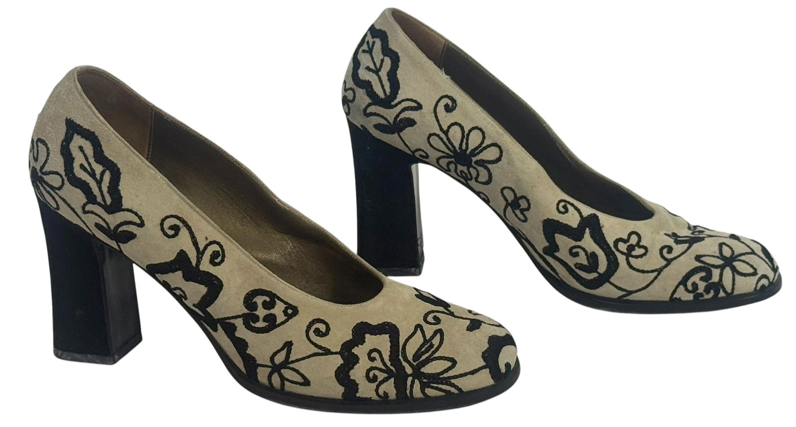 Yves Saint Laurent Embroidered Suede Pumps Sz 9: Pair of Yves Saint Laurent Italian-made heels featuring a beige suede upper adorned with intricate black floral embroidery. The shoes have a rounded toe, high block heel, and leather lining and soles.
