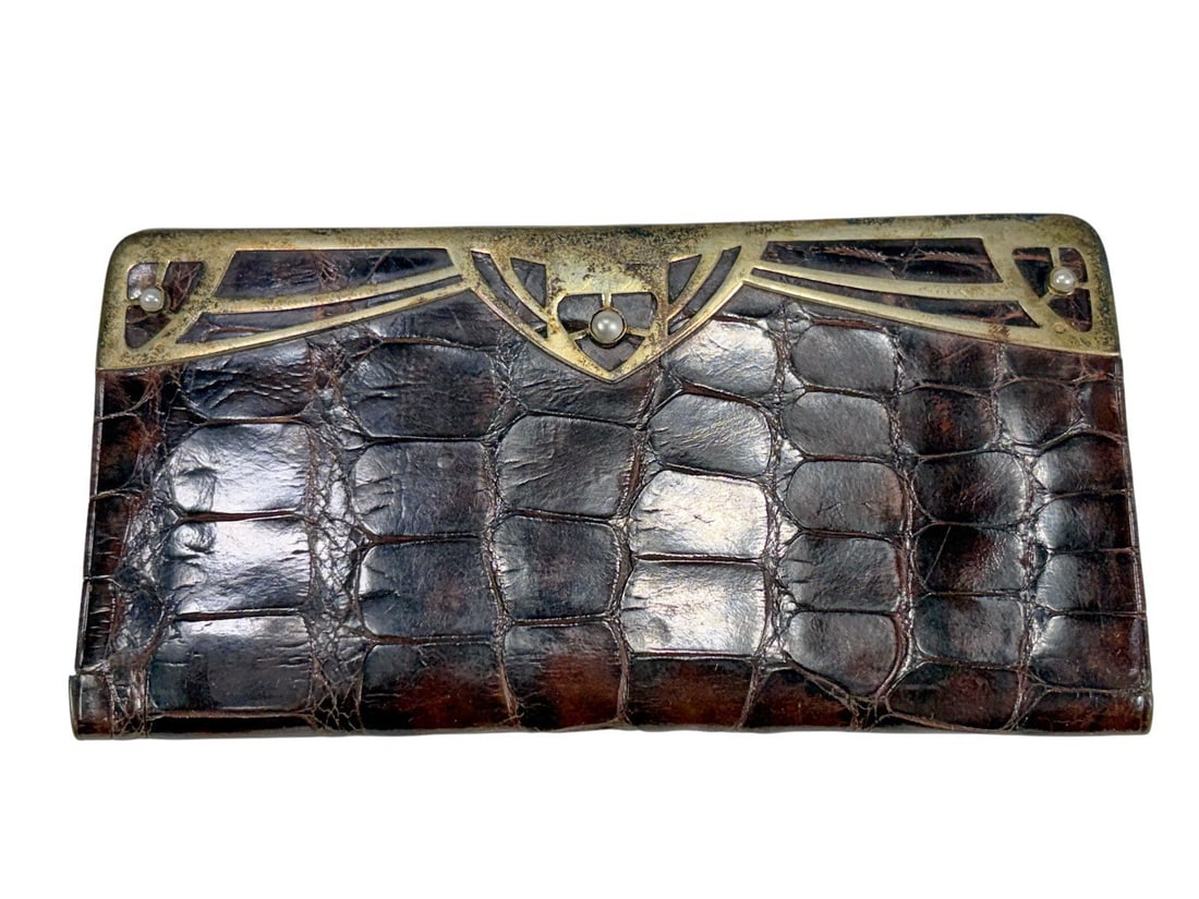1870 Austrian Art Nouveau Silver Crocodile Wallet: Austrian crocodile leather wallet, circa 1870, with silver gilt openwork mount set with seed pearls. Leather and silk lined interior. Includes fitted presentation case. Austro-Hungarian silver hallmar
