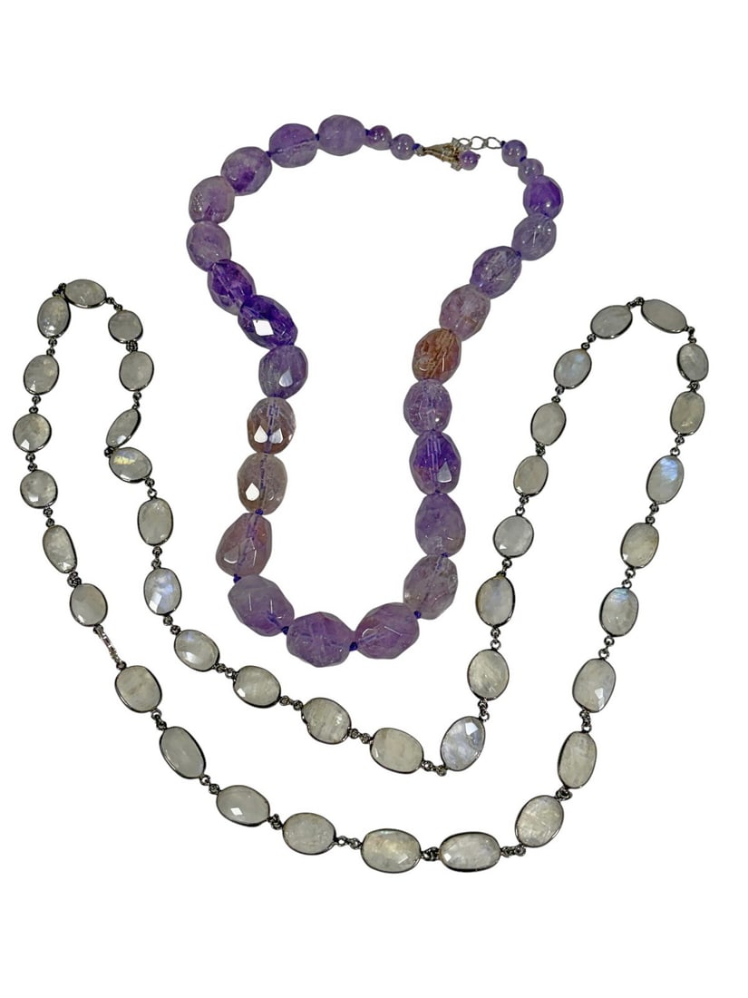 Amethyst & Rock Crystal Necklaces 2pc LOT: Two piece gemstone necklace lot with graduated faceted amethyst beads and bezel set moonstone cabochons in darkened links. Silver tone clasp. The longest necklace measures approximately 31 inches