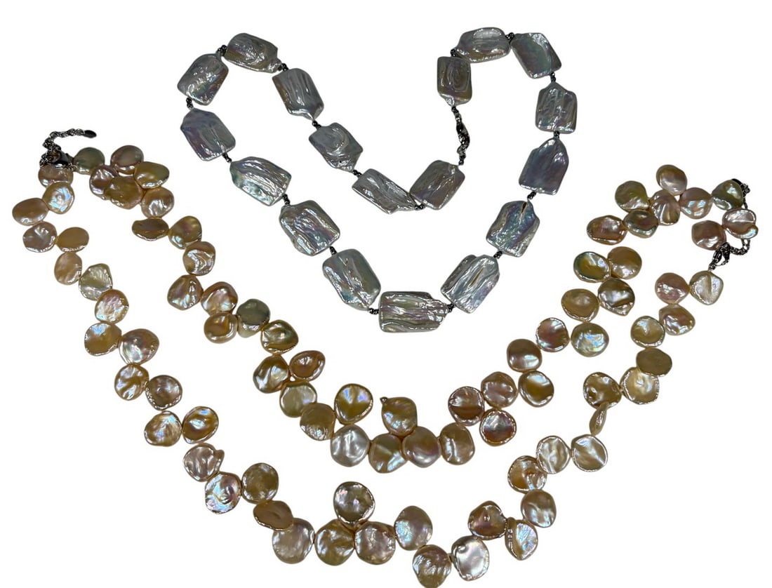 Freshwater Baroque Shaped Pearls Necklace 2pc LOT: Two iridescent freshwater pearl necklaces with baroque pearls. One with large rectangular white pearls and silver tone spacer beads, the other with coin style pearls in golden peach hues. The longest