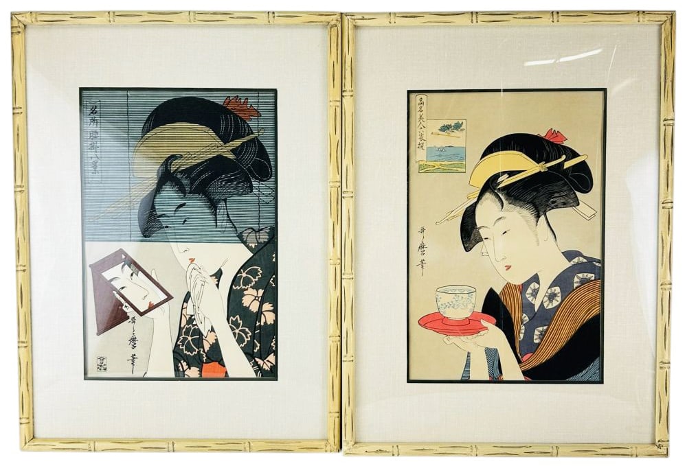 Japanese Pair Ukiyo-e Colored Wood Block Prints: Lot of two Ukiyo-e Japanese art wood block prints. One work depicts a woman holding a mirror, attributed to Utamaro. The second shows a figure offering a teacup, attributed to Eisen. Each includes