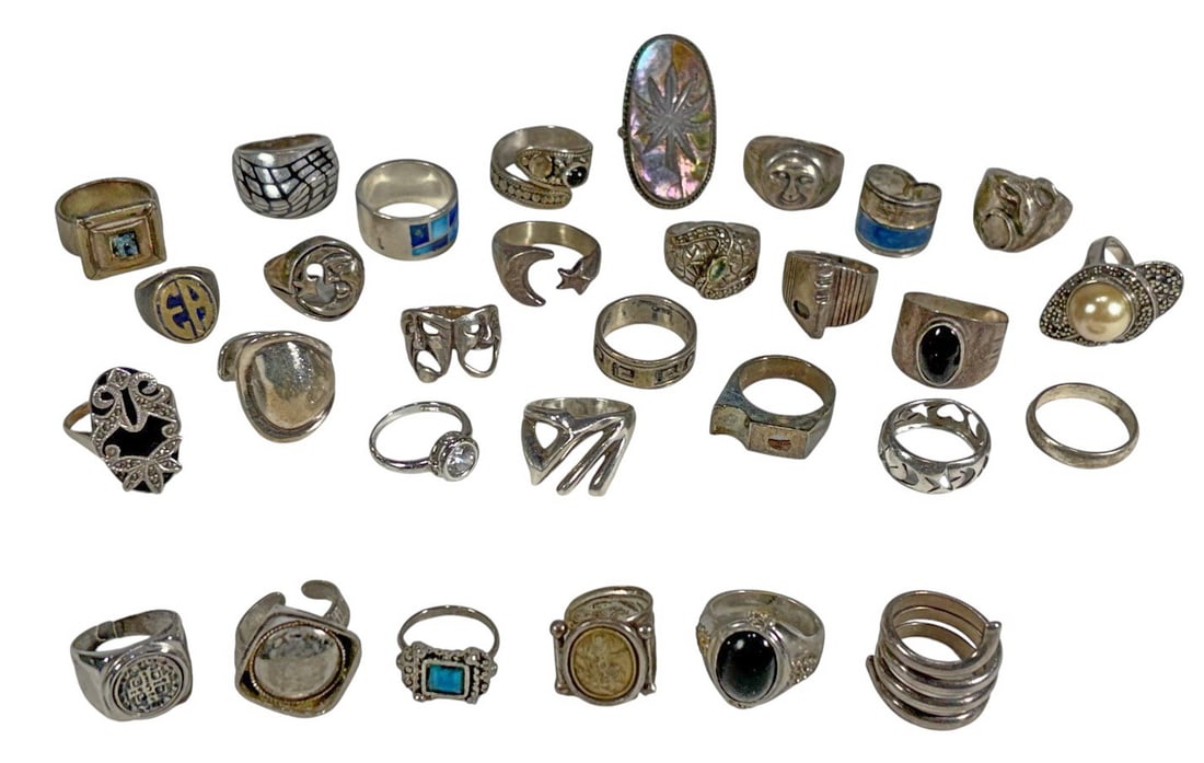 24 Sterling Silver 925 & 6 Metal Rings 30pc LOT: Group of 30 rings including 24 sterling silver examples and six non-silver rings, in assorted decorative designs with inlay, etched motifs, and stone-set styles. The largest measures approximately