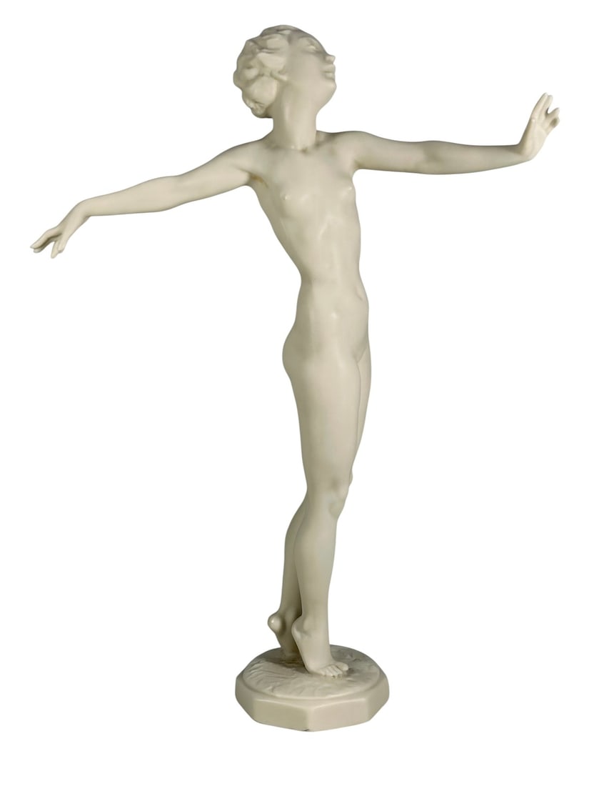 Hutschenreuther Nude Dancer Porcelain Figurine: Hutschenreuther Selb Kunstabteilung, Germany Art Deco bisque porcelain nude dancer figurine by Carl Werner, marked with green lion hallmark, 'Germany,' and an incised signature.Dimensions: 9.25 X 6.5