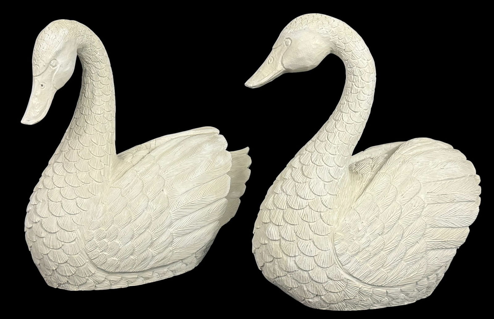 Large Hand-Carved Whitewashed Wood Swan Sculptures: Pair of large swan sculptures, hand-carved from wood and finished in a whitewashed paint. Each swan features intricately incised feather patterns, gracefully arched necks, and serene expressions,