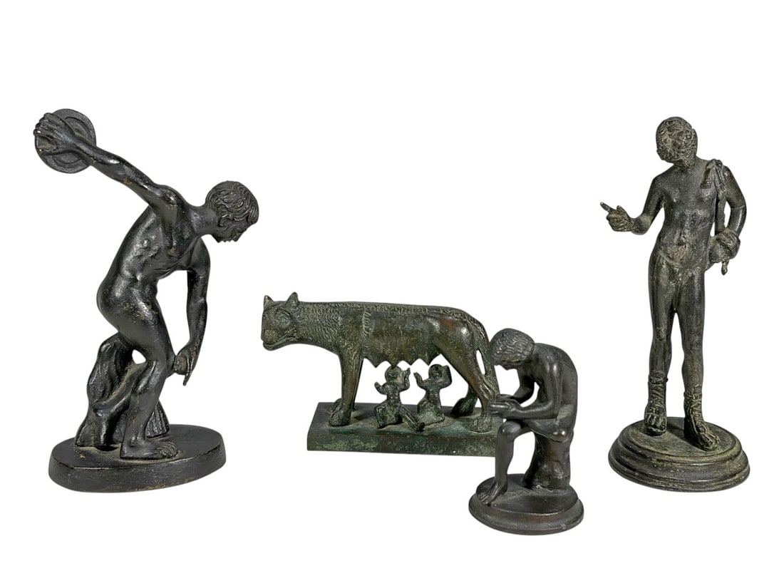 Discobolus, Spinario, Narcissus & Wolf Bronze 4pcs: Lot of four classical bronze sculptures after Greco-Roman models, including the Discobolus, Spinario, Narcissus, and the Capitoline Wolf with Romulus and Remus. The largest measures approximately