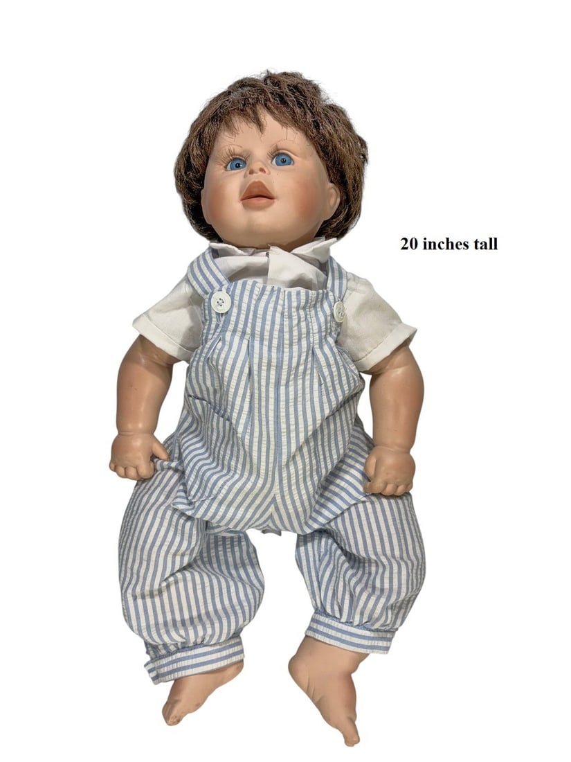 1987 DeHetre Originals Punkin Baby Doll: DeHetre Originals 'Punkin' baby doll from the 1980s with vinyl head and limbs, soft body, blue sleep eyes, and original outfit. Marked 'Punkin DeHetre Originals 1987' on the back of the