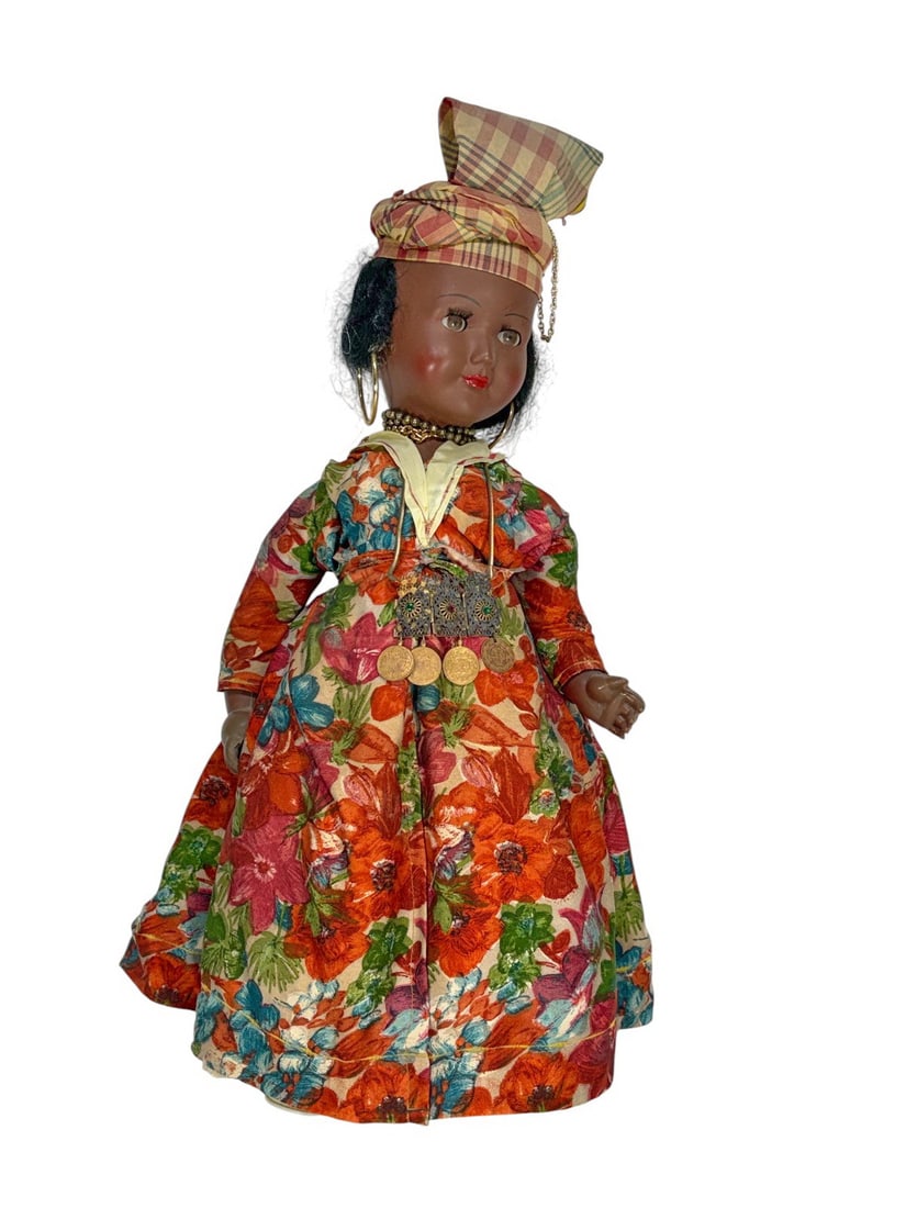 Bte S.G.D.G. French Dressed Girl Doll: Bte SGDG French 20th-century girl doll dressed in an elaborate regional costume with floral gown and decorative accessories. Marked 'Bte S.G.D.G. France' on the back of the neck.Dimensions: 21 X 9 X