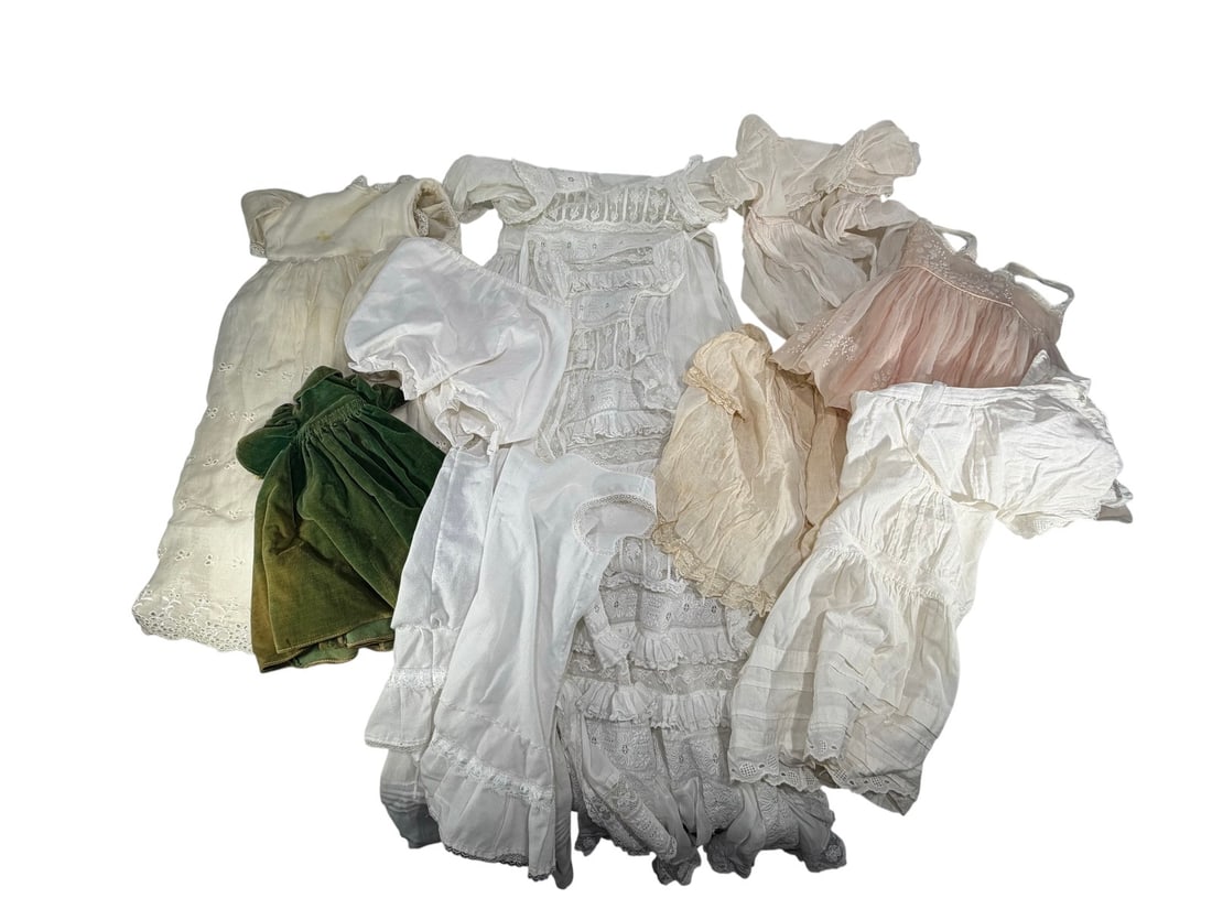 Vintage Group of Doll Mini Dresses 8pc LOT: Group of eight vintage doll dresses and undergarments, including lace-trimmed white cotton garments and one green velvet dress, in Victorian style. The largest measures approximately 34 inches tall