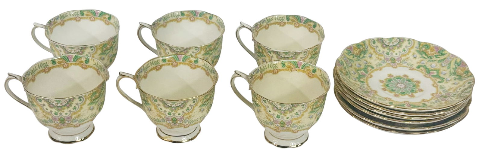 Royal Albert Paisley Shawl Tea Set, Service for 6: Service for six, Royal Albert tea set featured in the Paisley Shawl pattern. This set includes six matching teacups and six saucers, each adorned with gilt trimmed handles and rims. Each piece is