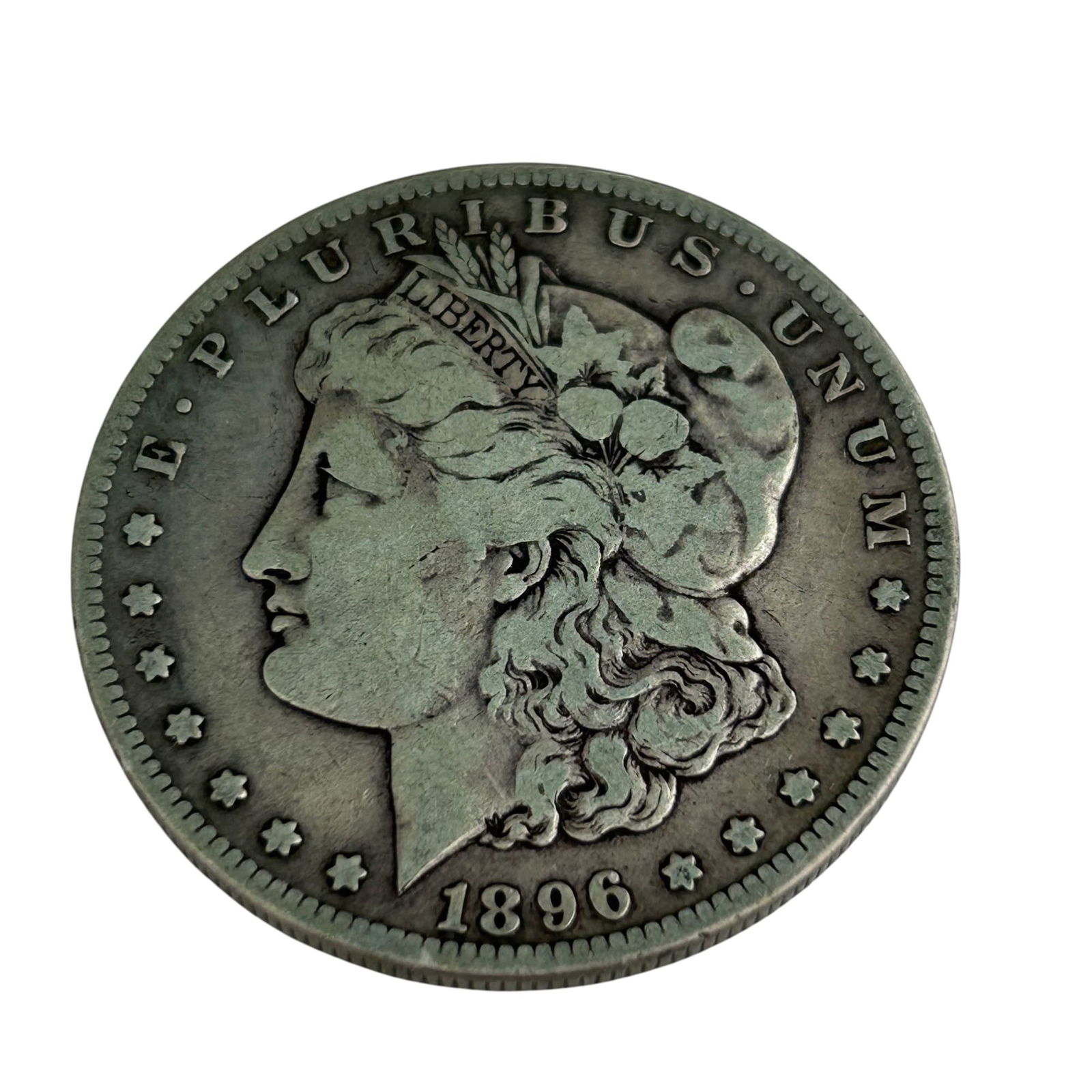 United States 1896 S Morgan Silver Dollar Coin: United States 1896 Morgan Silver Dollar struck in San Francisco. Designed by George T. Morgan, featuring Liberty in profile on the obverse and a heraldic eagle with outstretched wings on the reverse.