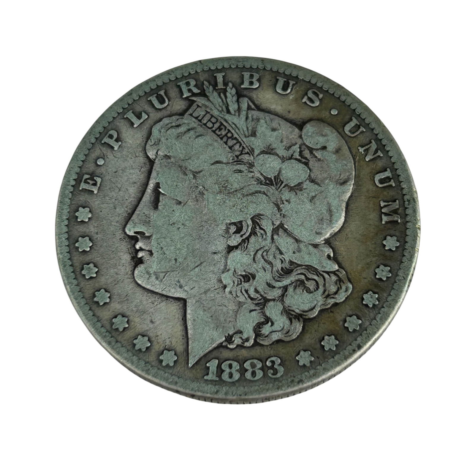 United States 1883 Morgan Silver Dollar Coin: United States 1883 Morgan Silver Dollar designed by George T. Morgan. The obverse features Liberty in profile with the motto E Pluribus Unum, while the reverse shows a heraldic eagle with outstretched