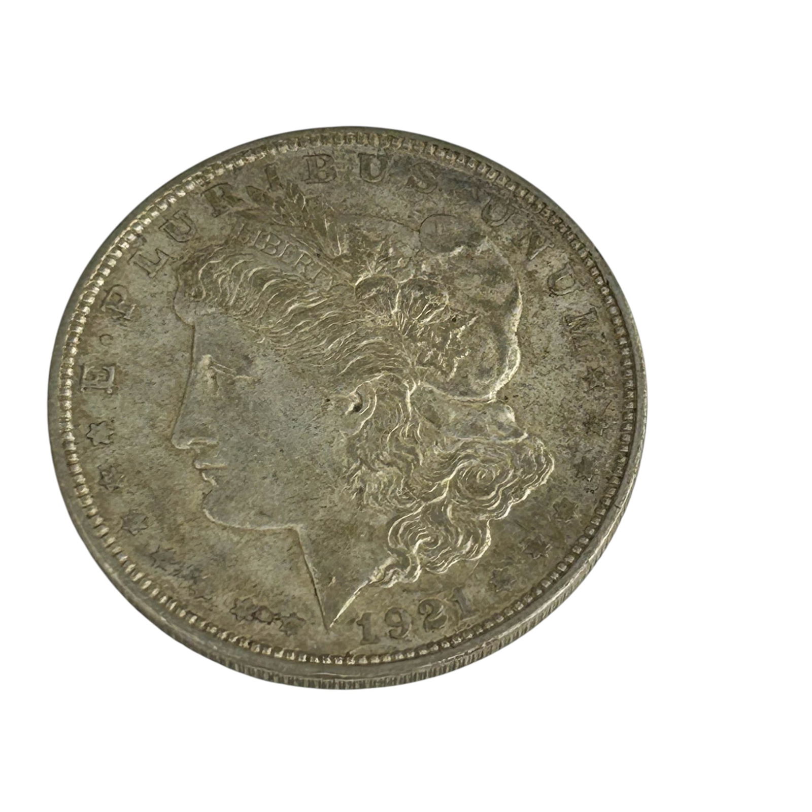 United States 1921 D Morgan Silver Dollar Coin: United States 1921 Morgan Silver Dollar struck in Denver. Designed by George T. Morgan, the obverse features Liberty in profile with the motto E Pluribus Unum, and the reverse shows a heraldic eagle w