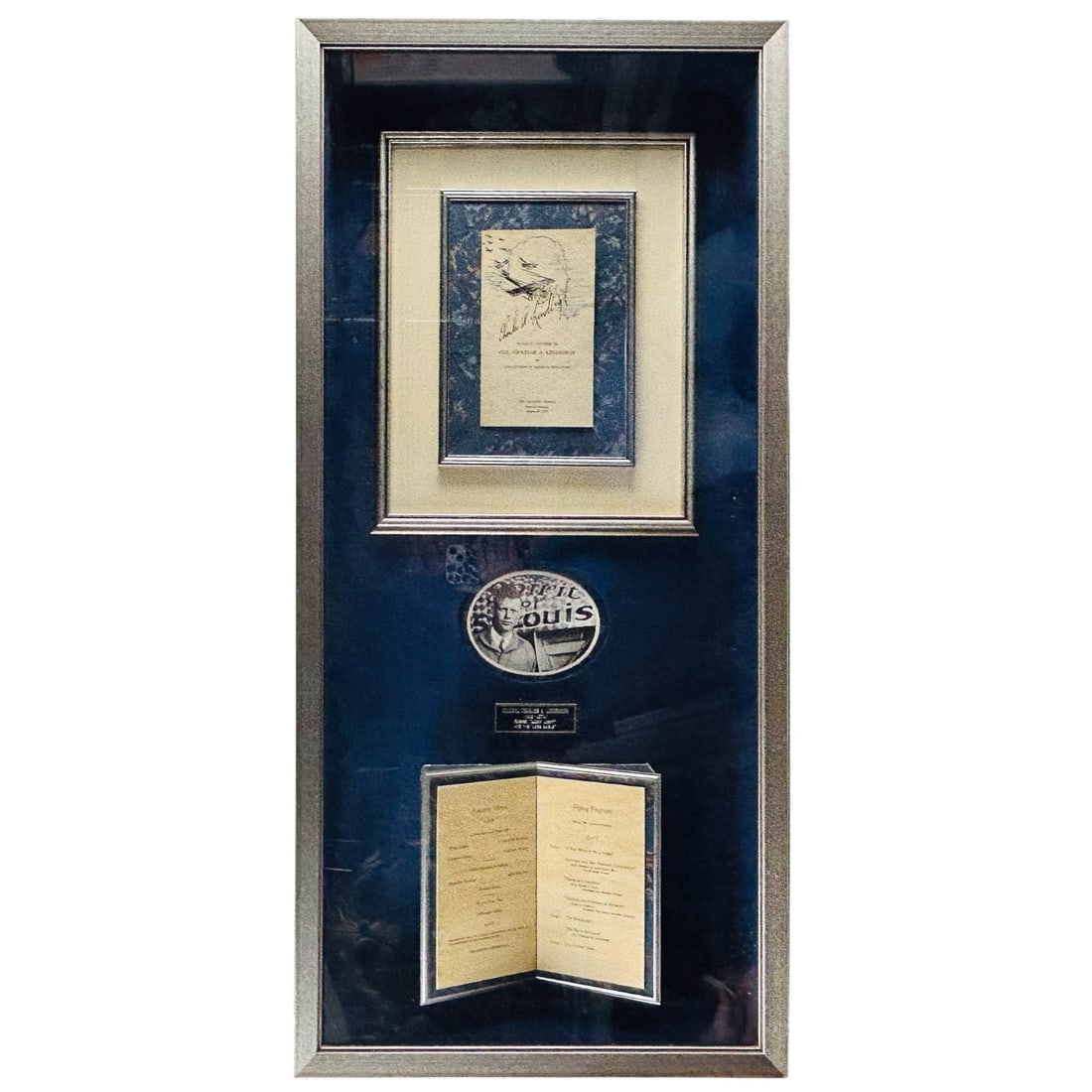 Lindbergh Signed 1927 Banquet Menu Framed Display: Framed presentation featuring a 1927 Madison, Wisconsin banquet menu signed by Charles A. Lindbergh, held in honor of his transatlantic flight. Includes photograph, biographical plaque, replica Spirit