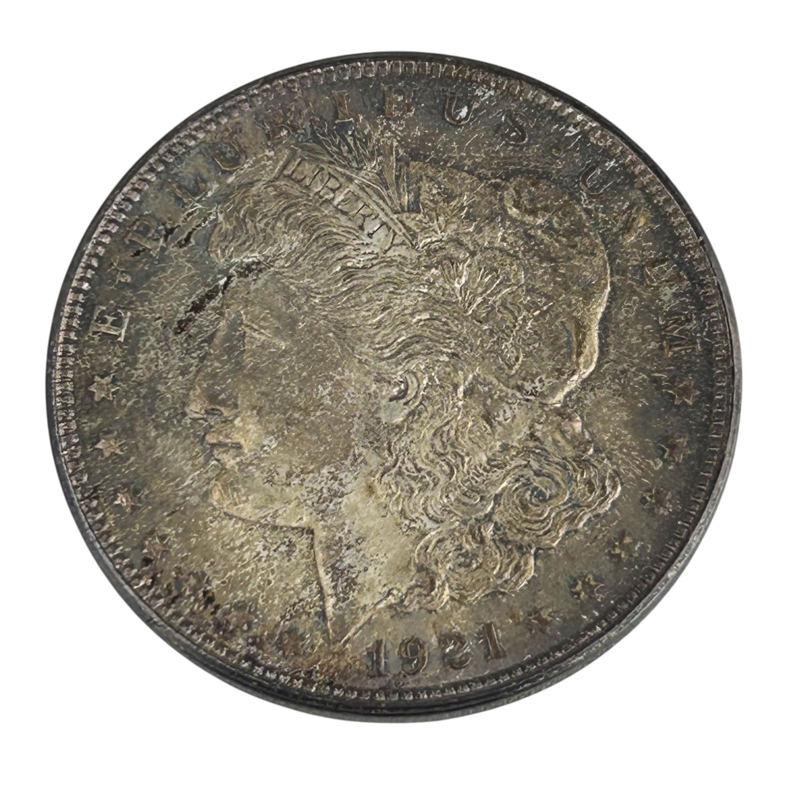 United States 1921 Morgan Silver Dollar Coin: United States 1921 Morgan Silver Dollar designed by George T. Morgan. Obverse depicts Liberty in profile surrounded by the motto E Pluribus Unum, while the reverse features a heraldic eagle with outst