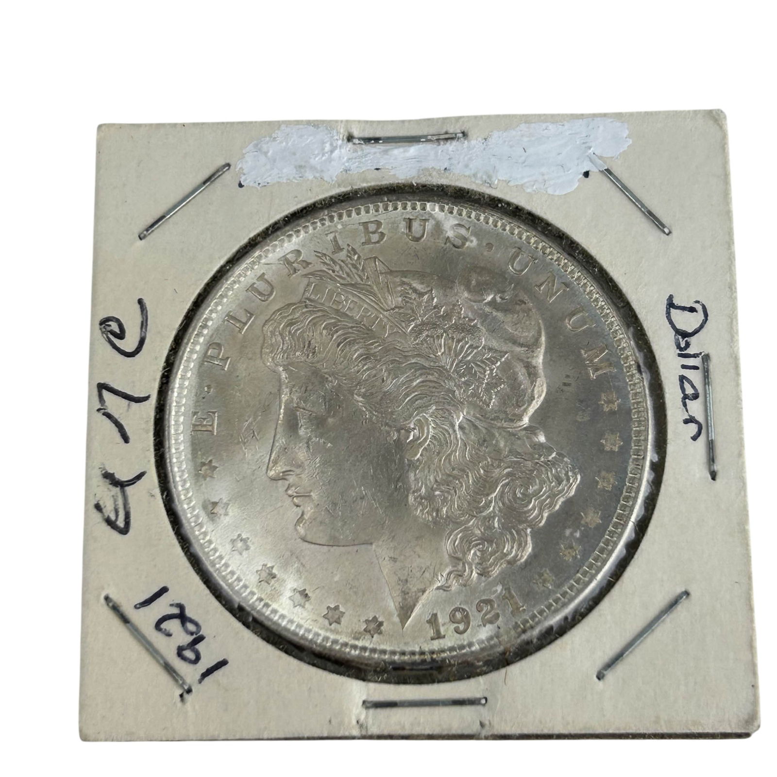 United States 1921 Morgan Silver Dollar Coin: United States 1921 Morgan Silver Dollar designed by George T. Morgan. Obverse features Liberty in profile with the motto E Pluribus Unum, and the reverse shows a heraldic eagle clutching arrows and an