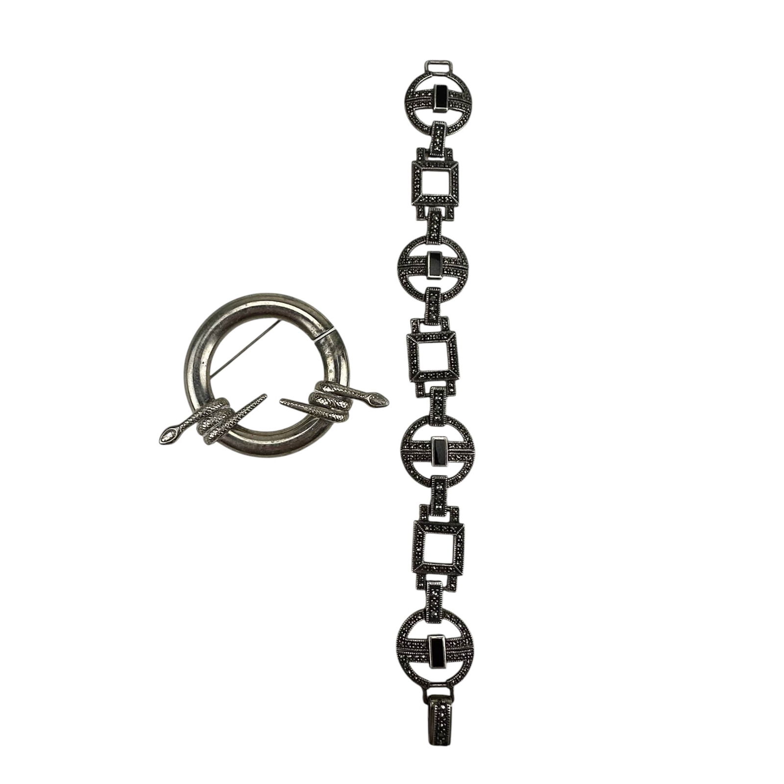 Sterling Serpent Snake Brooch & Marcasite Bracelet: Lot of two sterling silver 925 ladies jewelry items. includes a round brooch with coiled snake wrap detail and a geometric link bracelet with marcasite and black stone insets. Pin measures approximate
