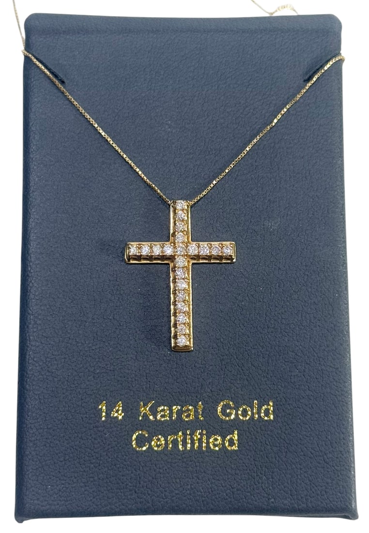 14K Yellow Gold & .5ct Diamond Cross Necklace: 14 karat yellow gold necklace that features a cross pendant encrusted with round brilliant cut diamonds. The pendant is set with diamonds ranging in size from 1.79 to 1.78 mm, with an estimated total