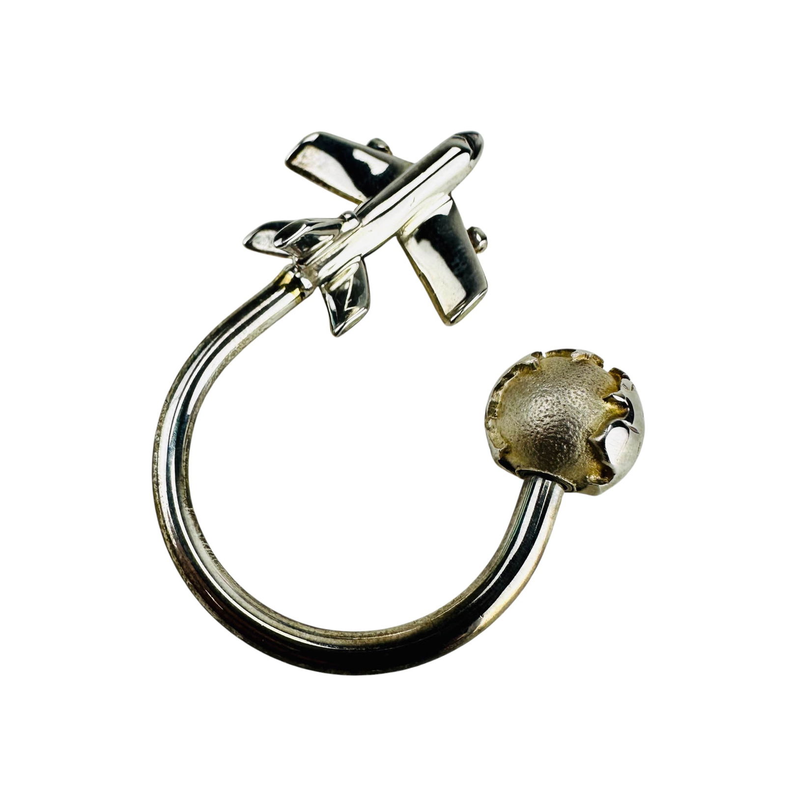 Tiffany Co Sterling Airplane Globe Travel Key Ring: Tiffany & Company sterling silver 925 key ring with rotating globe finial and attached aircraft. Measures approximately 1.75" x 1.75" x .50". Marked Tiffany & Co 925. Total weight approximately 18 gra