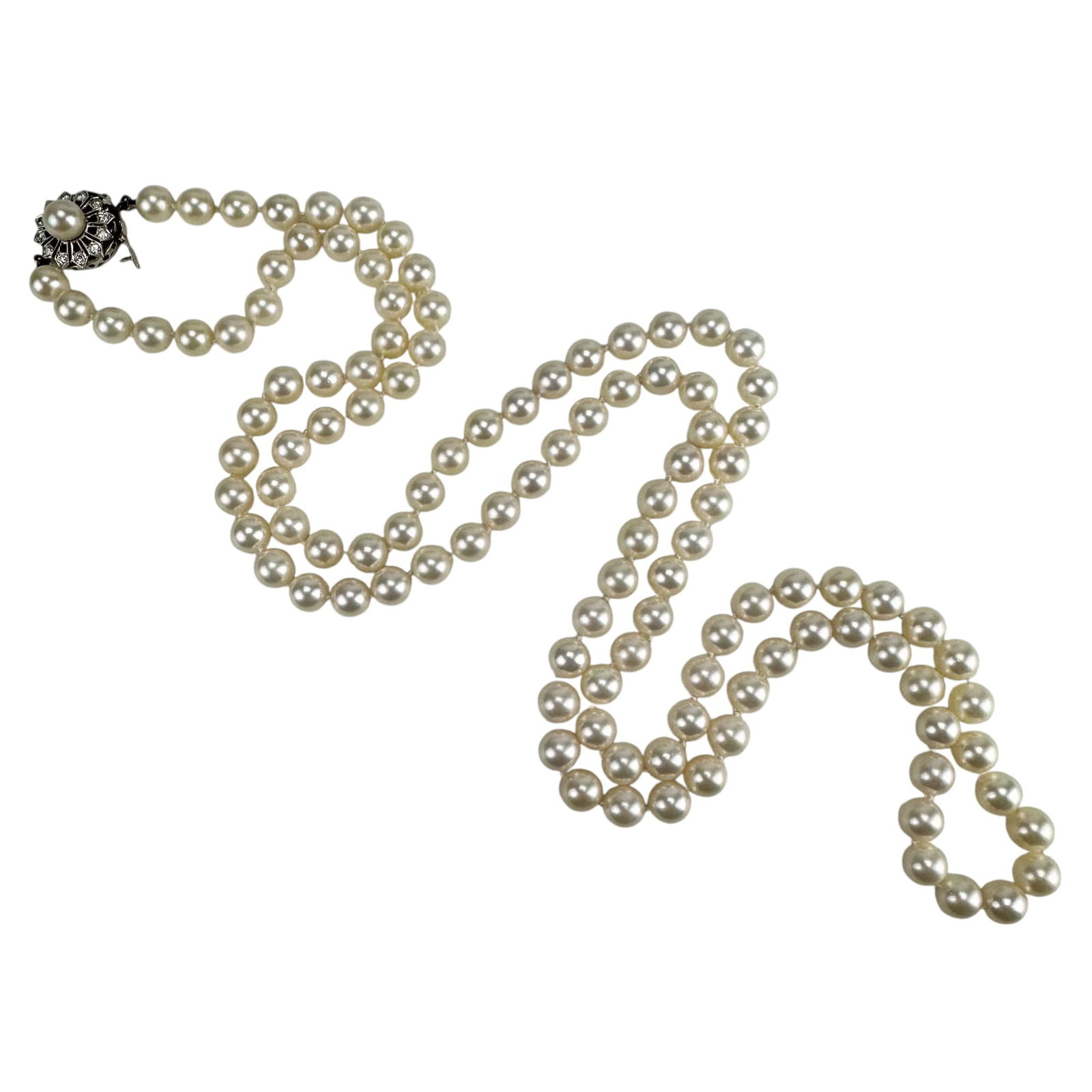 White Akoya Pearl Diamond Necklace 14K Gold Clasp: Saltwater cultured Akoya single strand round pearl necklace with a 14K white gold clasp set with a pearl and surrounded by 0.25 ctw (carat total weight) of diamonds. Measures approximately 37.25". Pea