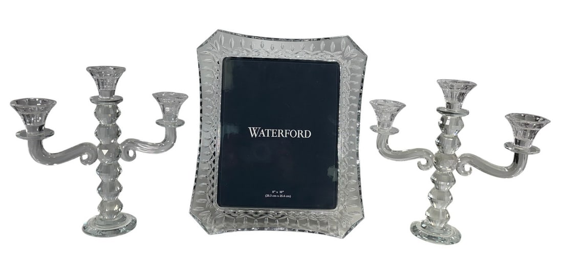 Waterford Picture Frame & Candlesticks Fine 3pcs: Three piece crystal lot, Waterford picture frame with beveled leaf and diamond cuts and etched mark, plus pair of unmarked three light crystal candelabra with faceted stems, scrolled arms, flared hold