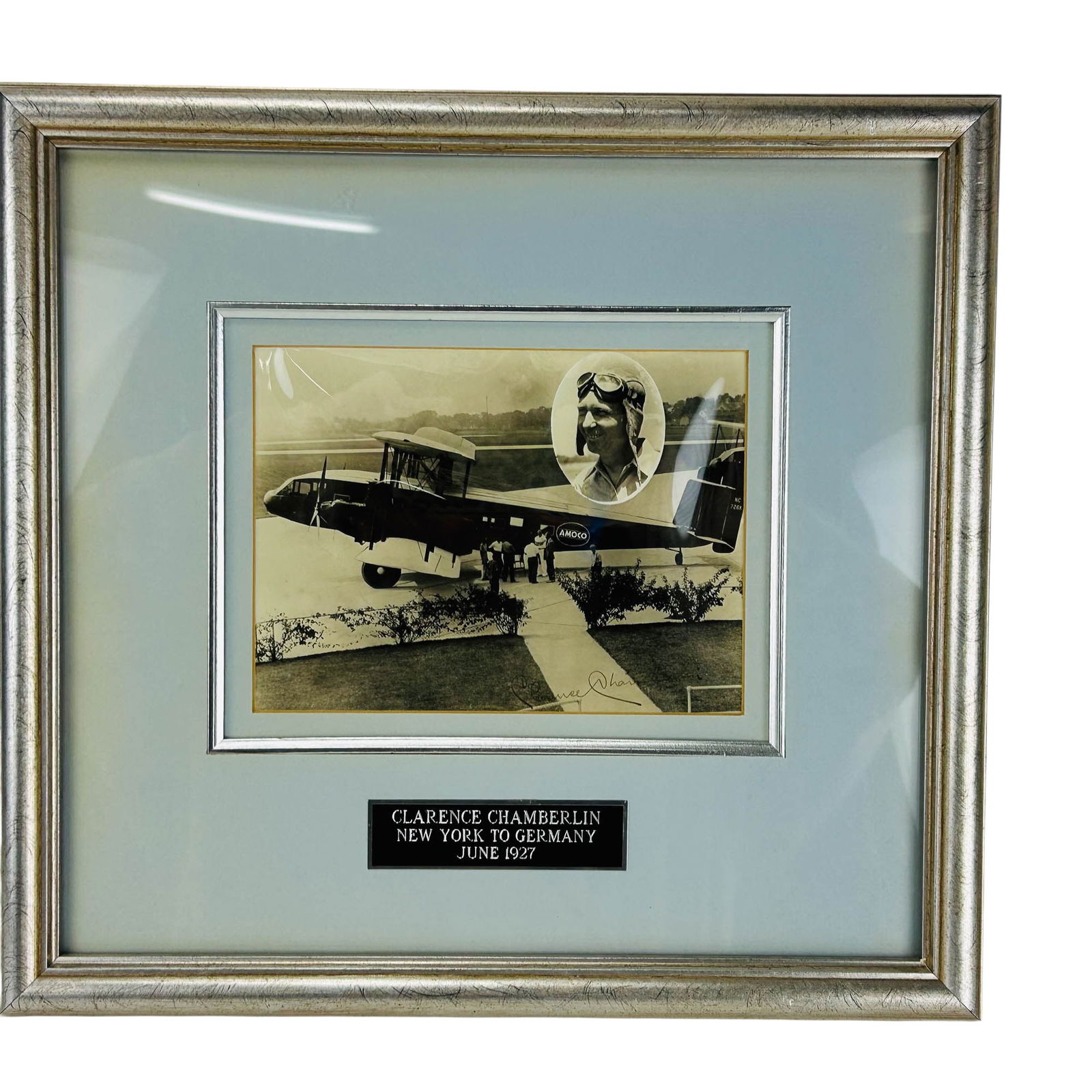 Clarence Chamberlin B&W Signed Transatlantic Photo: Framed signed photograph of aviator Clarence Chamberlin (American, 1893-1976) pioneering American aviator, with Bellanca monoplane used for the transatlantic flight from New York to Germany in June 19