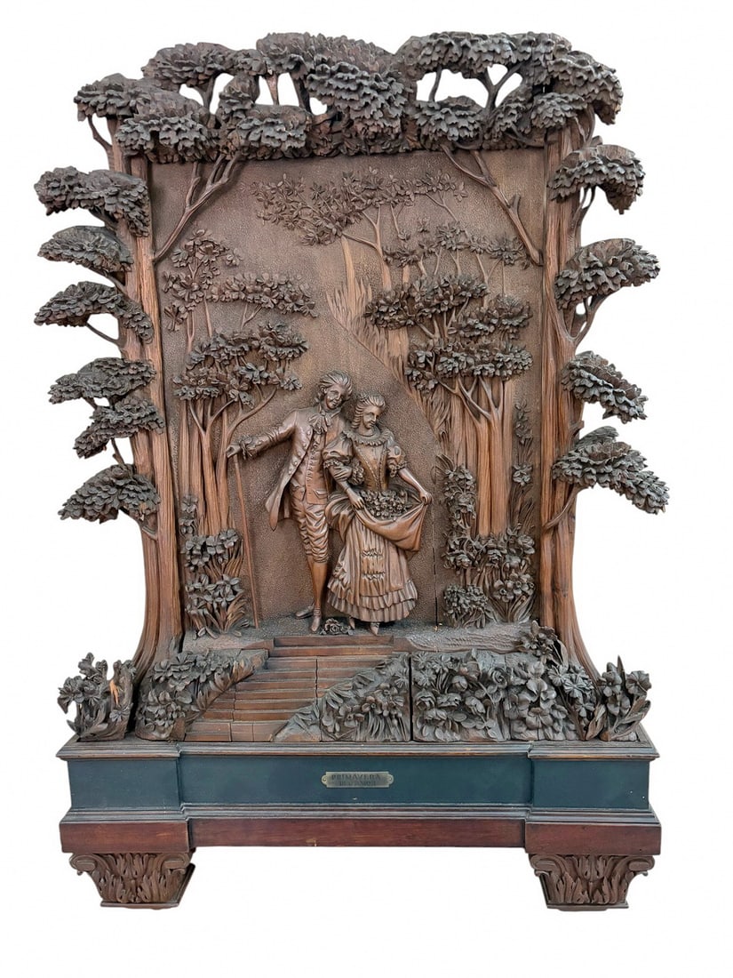 Antique Victorian Carved Wood Romantic Wall Panel: Carved wood wall panel titled 'Primavera del Amor,' Springtime of Love, with brass plaque. High relief courting couple scene with deeply carved foliage, mounted on plinth base with integrated shelf.Di