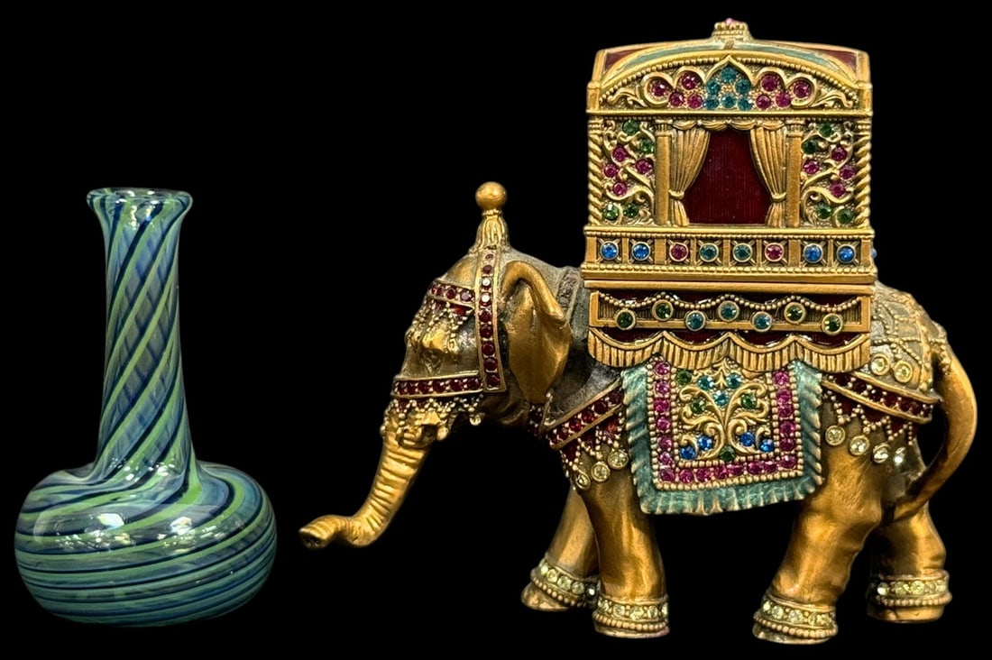 Artist-Signed Swirl Glass Bud Vase & Elephant Box: Estate lot of two distinctive decorative vanity pieces. The first is an art glass bud vase with a twisted swirl pattern in shades of green and blue. The piece features a bulbous base and flared rim, a