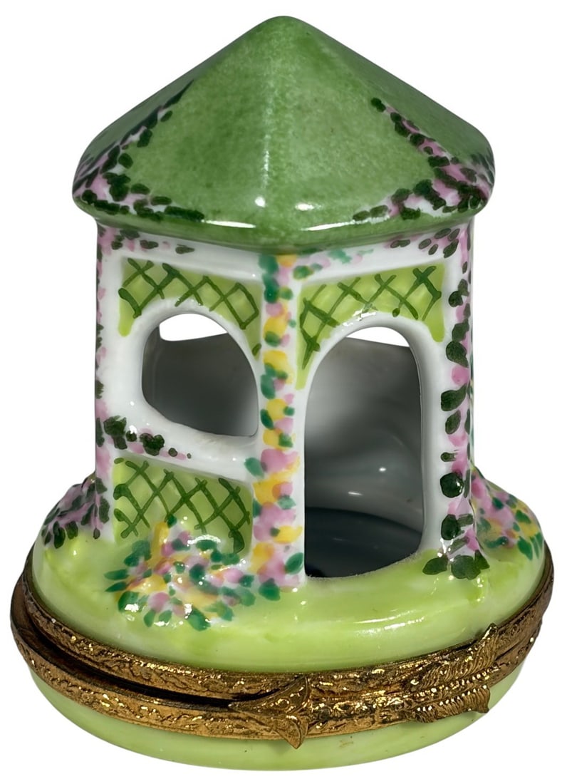 Limoges France Artoria Garden Gazebo Trinket Box: Artoria Limoges porcelain trinket box in gazebo form. Hand painted with vibrant florals and lattice detailing. Green domed roof and soft green circular base. Ornate gilt metal mount and clasp. Base is