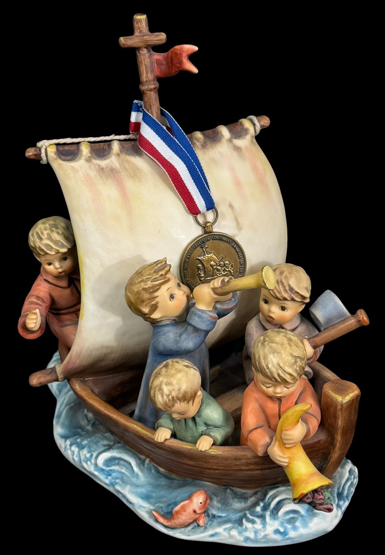 Goebel M.I. Hummel Land in Sight L/E Figurine 10": Goebel M.I. Hummel limited edition figurine celebrating the 500th anniversary of America's discovery (1492 - 1992) titled 'Land in Sight.' Featuring six children aboard a ship, one child holds a spygl