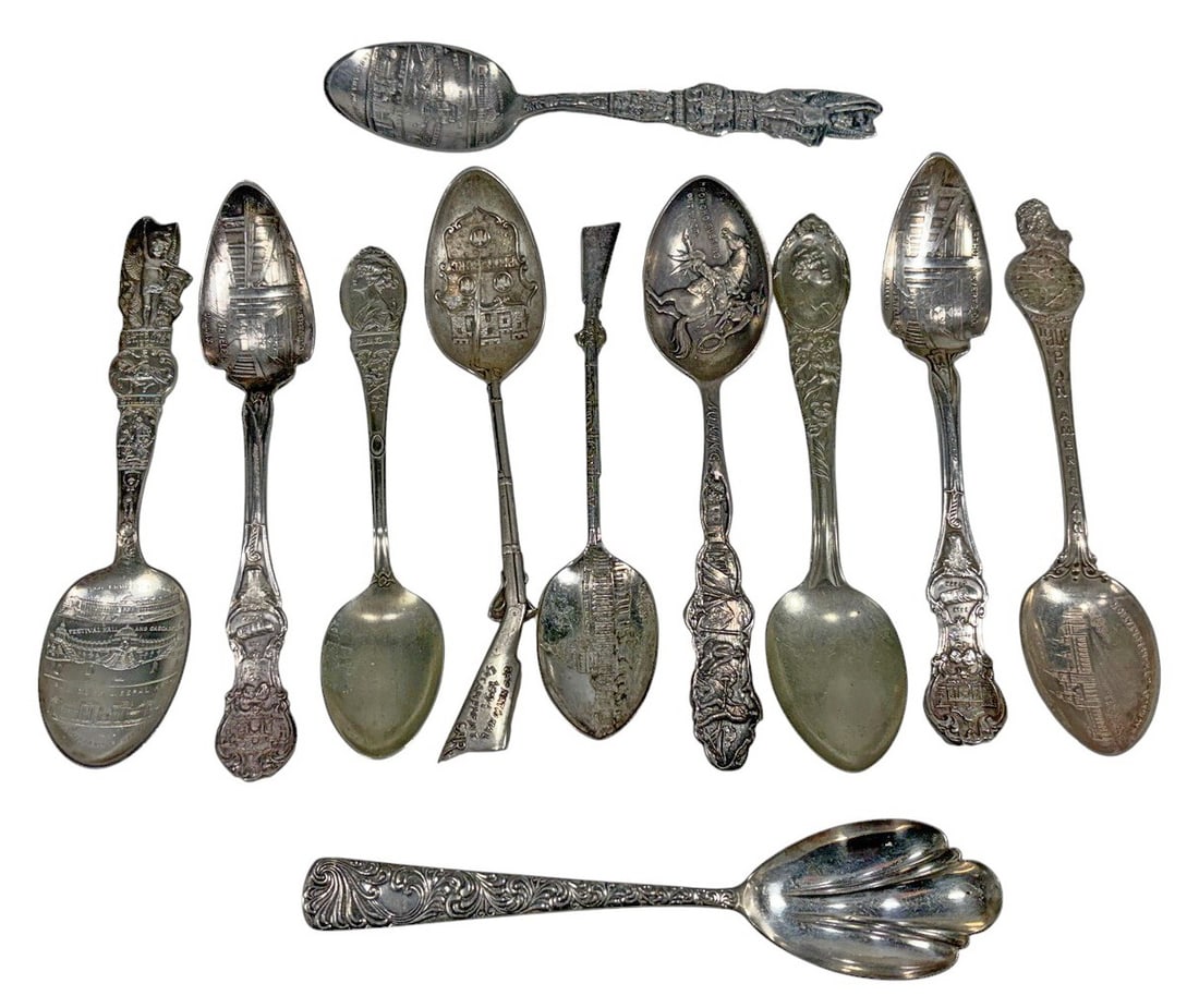 Vintage Silverplated Souvenir Spoons Assorted 11pc: Vintage silverplated souvenir spoon group of 11 pieces with pictorial and figural decoration including architectural scenes, Western themes, patriotic and fraternal imagery, and commemorative