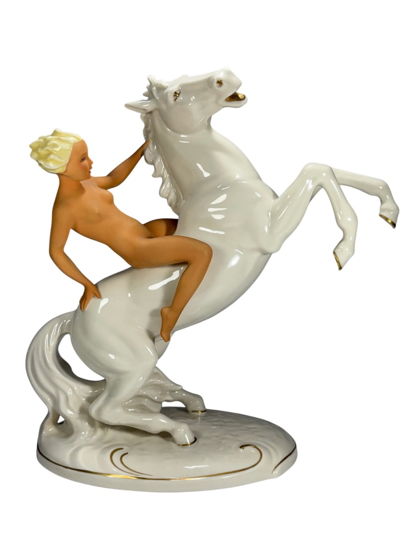 Schaubach Kunst Nude on Horse by Karl Steiner Fig: Schaubach Kunst porcelain nude on rearing horse figurine designed by Karl Steiner. Stylized female nude seated astride a rearing white horse, leaning back with one hand along the neck, blonde hair and