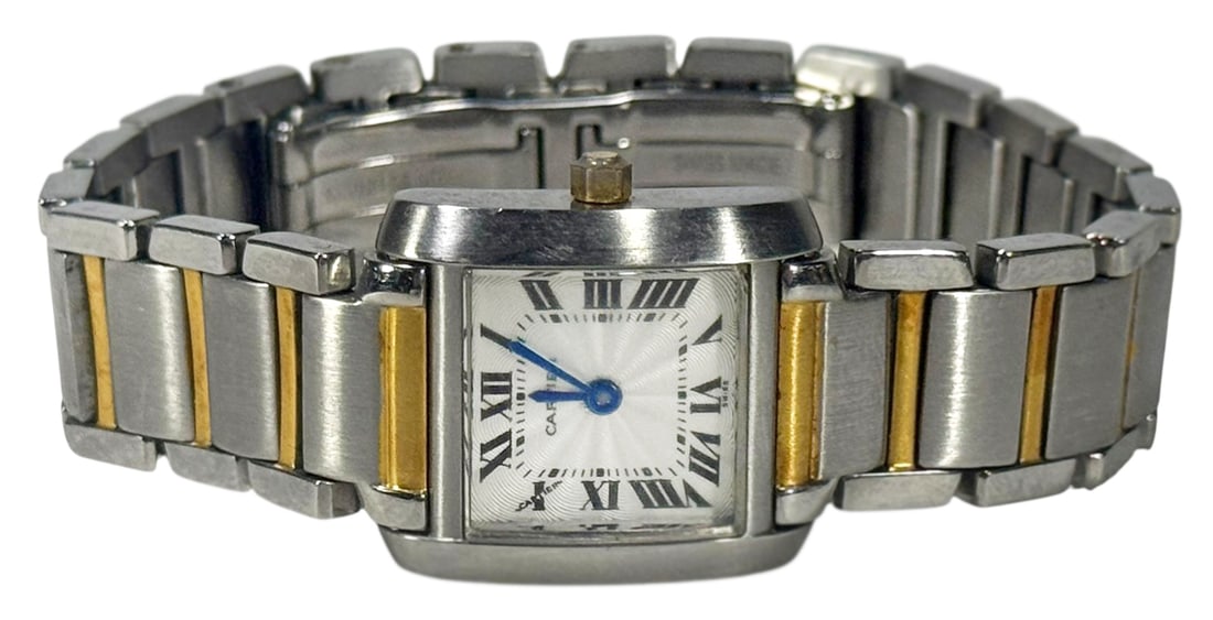 Ladies Two-Tone Stainless Tank Style Wristwatch: Ladies vintage stainless steel two tone designer inspired tank-style wristwatch. Crafted with a Deco-style Roman numeral dial and blue steal hands. Japanese battery powered movement. Bears engravings 