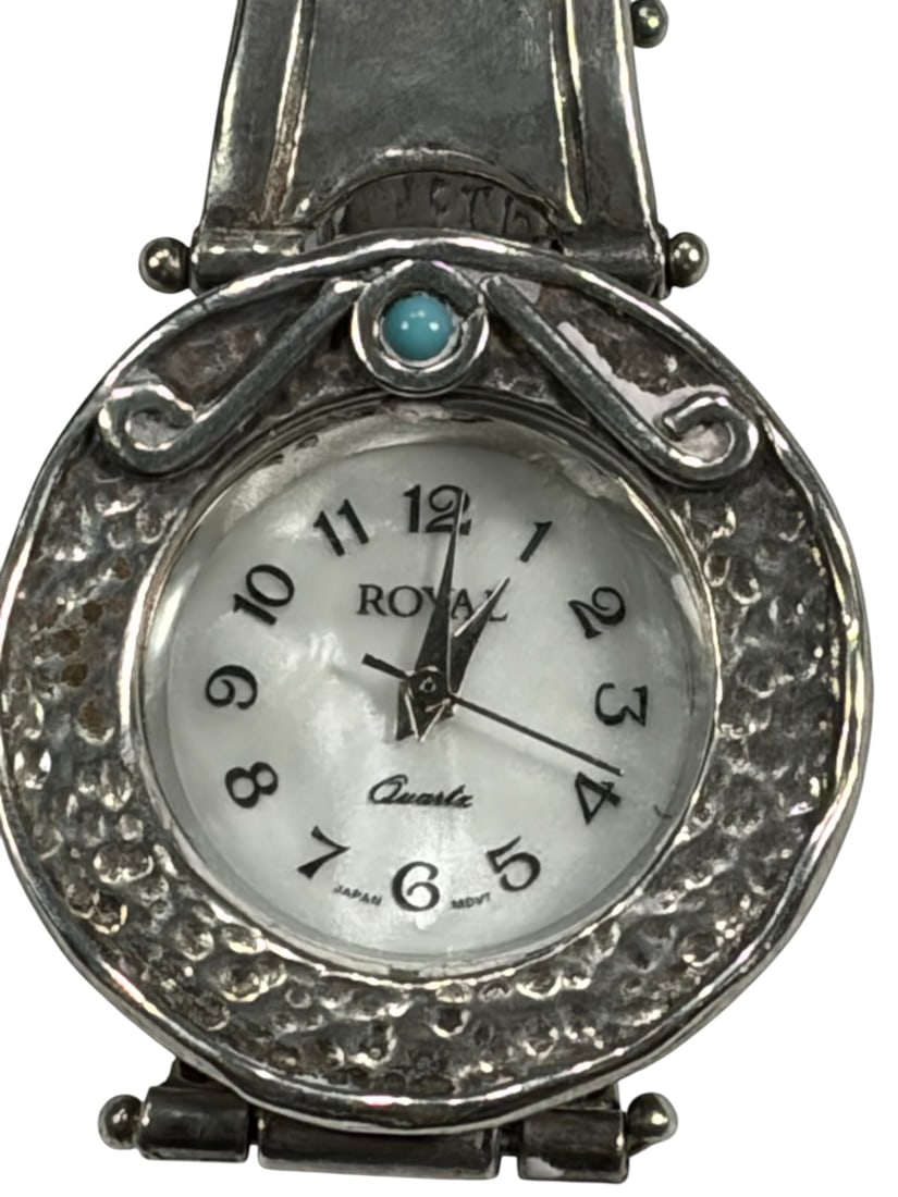 Royal Quartz Sterling 925 Band & Turquoise Watch: Royal Quartz wristwatch with sterling silver .925 case and hinged bracelet, hammered texture and scrollwork bezel, and turquoise cabochon accent above the dial. White dial with Arabic numerals, marked