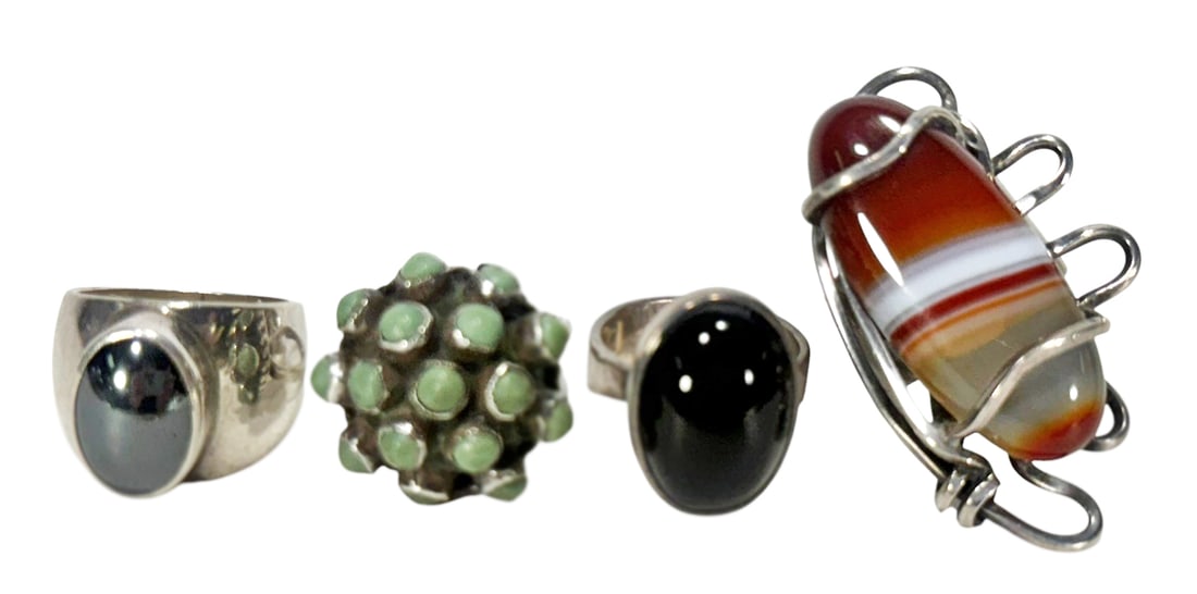 Vtg Sterling Silver Rings: Onyx, Agate & Jade 4pcs: Lot of four vintage 20th-century artist-signed sterling silver rings. Featuring a bold sculptural sterling and banded agate ring by Otto Robert Bade (ORB), a domed Taxco sterling and green jade