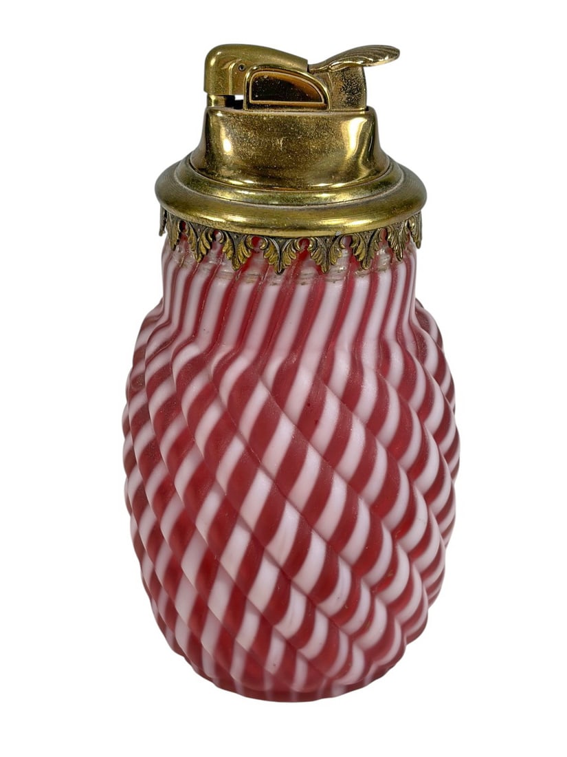 Vintage Opalescent Cranberry Swirl Glass Lighter: Vintage opalescent cranberry swirl glass table lighter with molded spiral ribbed body in cranberry red and milky white glass. Satin finish with gilt metal lighter mount and pierced metal base