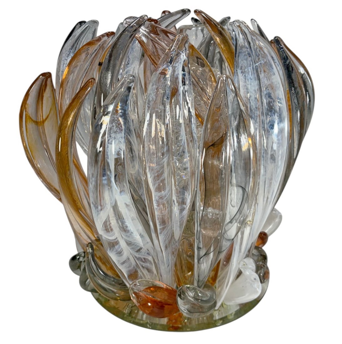 Cofrac Art Verrier Style Blown Glass Centerpiece: Cofrac Art Verrier style sculptural blown glass centerpiece. Clear, amber, smoke, and white petal or flame elements rise from a circular clear base with subtle green tone and applied perimeter accents