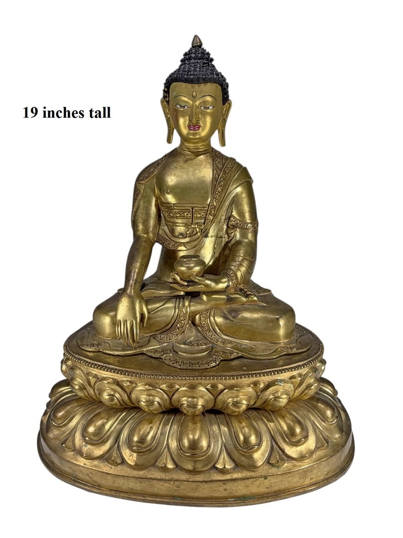 Shakyamuni Buddha Nepalese Gilt Bronze Sculpture: Nepalese gilt bronze Shakyamuni Buddha, two pieces. Seated in meditation on a double lotus base, with begging bowl and bhumisparsha mudra, with painted facial details and incised robe borders. Separat