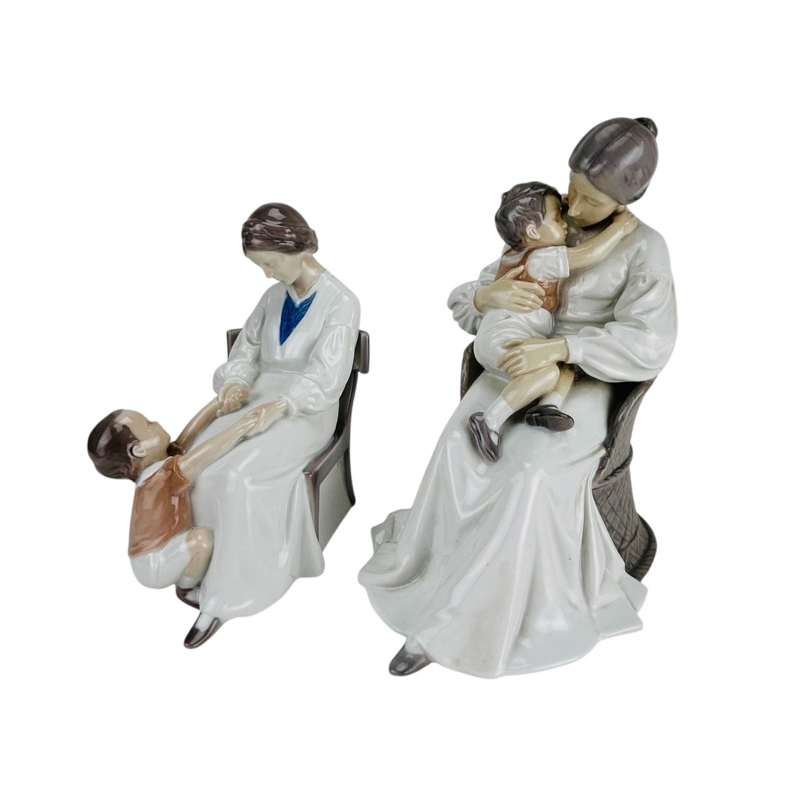 Bing Grondahl Porcelain Mother Child Figurine LOT: Bing and Grondahl Denmark grouping of two Danish porcelain figurines. Includes Mother Love model number 1552 and Dickies Mama model number 1642, both designed by sculptor Ingeborg Plockross Irminger (