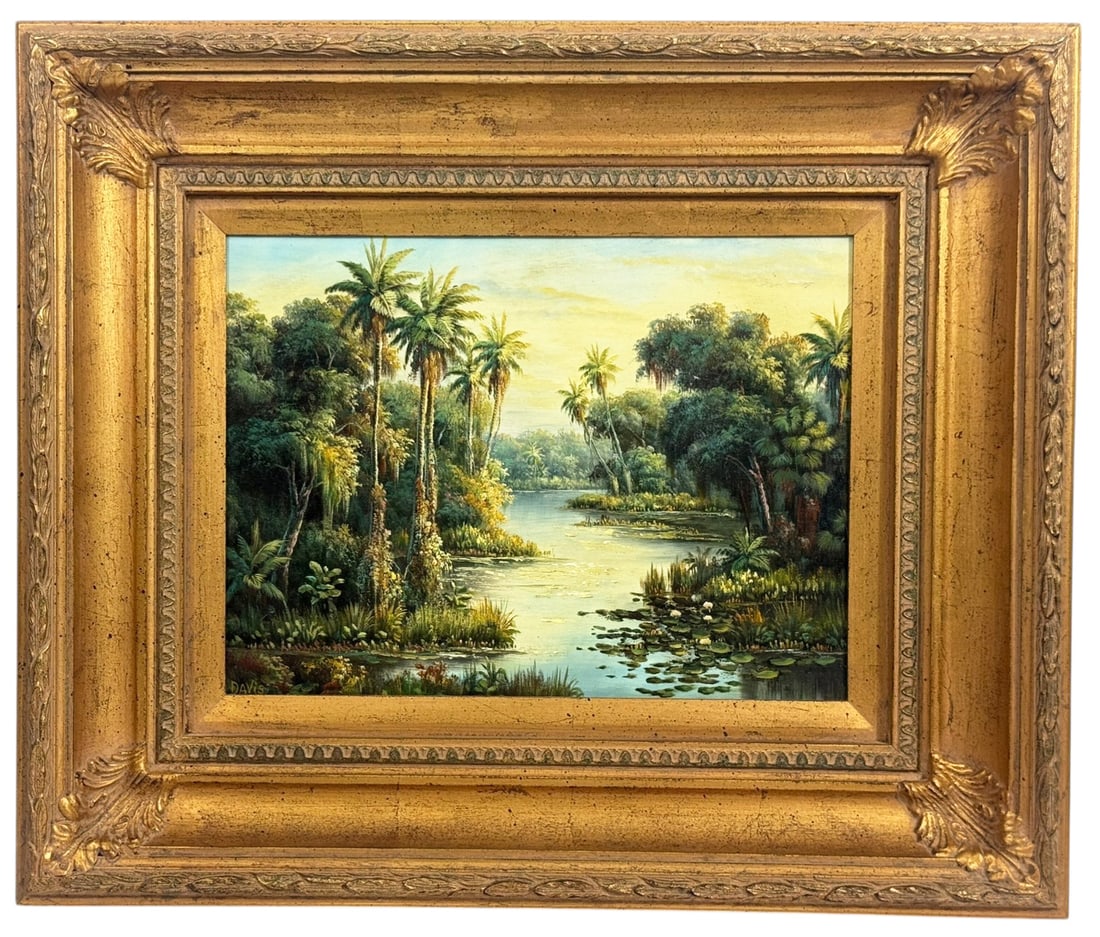 Tropical River Landscape Oil Painting SIGNED: Late 20th/Early 21st century tropical landscape oil painting depicting a winding river surrounded by palm trees and dense vegetation with lily pads along the water's edge. The scene features layered f