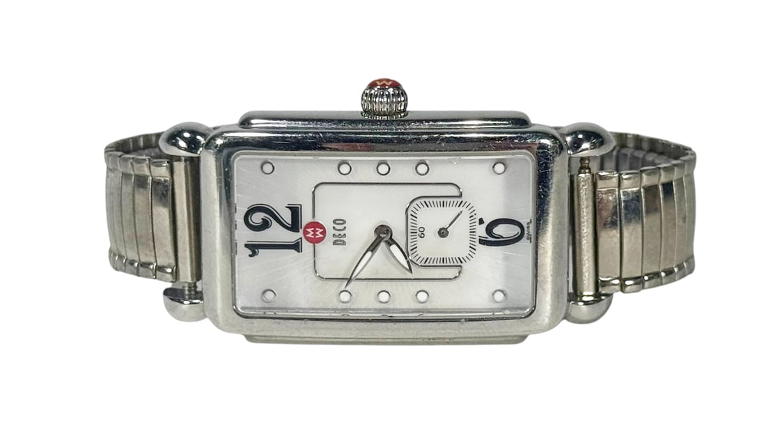MW Milano Stainless Steel Swiss Quartz Watch: MW Milano vintage Swiss quartz wristwatch featuring a rectangular stainless steel case with rounded edges and enameled dial. The dial includes oversized 12 and 6 numerals, applied dot hour markers, an