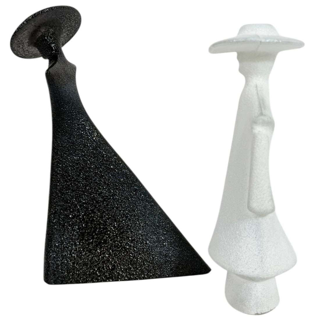 2pc Kosta Boda Art Glass Figurines by Kjell Engman: Lot of two Kosta Boda art glass figurine designed by Kjell Engman (Scandinavian, born 1946) from the Catwalk Series. Featuring "Black Madame" a sleek black glass figure with a textured surface, flared