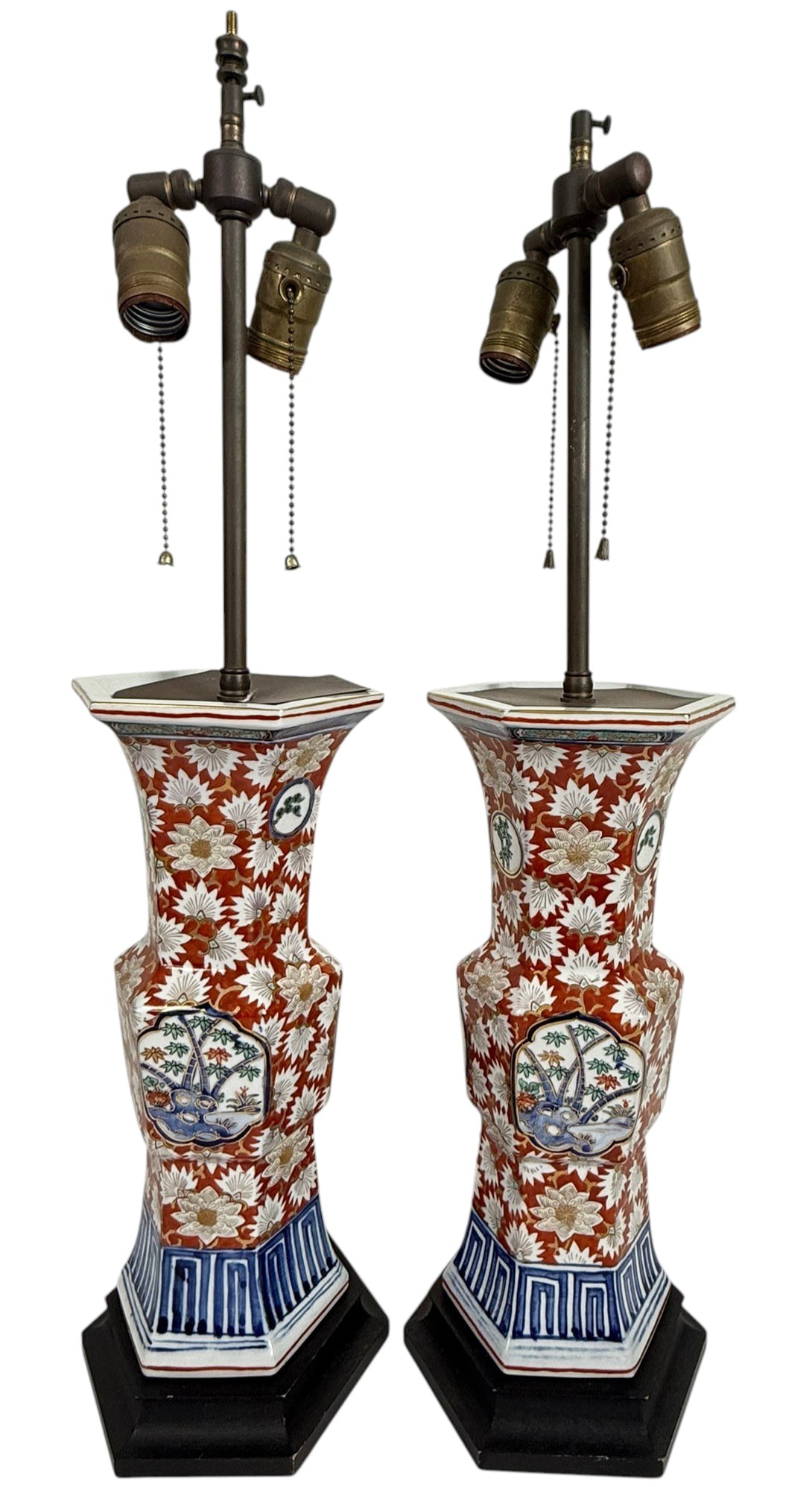Pair of Imari Style Porcelain Vase Lamps 24" H: Pair of vintage porcelain vase lamps in the Japanese Imari style, featuring a bold floral chrysanthemum motif in rich iron red, cobalt blue, and gilt highlights. Hexagonal bodies with flared rims, mou