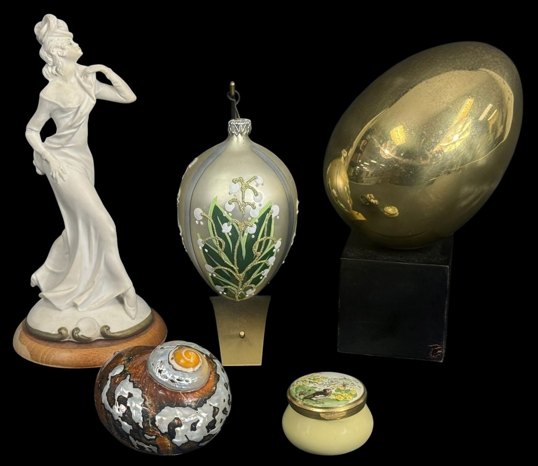 Capodimonte, Hans Turnwald, Halcyon & More 5pcs: Group of five (5) decorative tabletop assorted objects. To include a Capodimonte figurine of an Art Nouveau-style lady, a hand-painted egg ornament with stand, a polished brass modernist egg on a blac